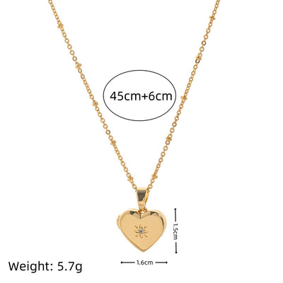 Gold heart-shaped pendant necklace with measurements and weight on a white background