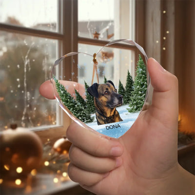Heart-shaped glass ornament featuring a photo of a pet, surrounded by a winter forest scene, ideal as a pet memorial keepsake