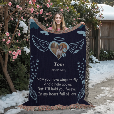 Personalized pet memorial woven blanket with angel wings, halo, photo, name, date, and remembrance poem on a navy background