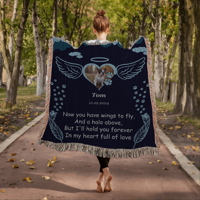 Personalized pet memorial woven blanket with angel wings, halo, photo, name, date, and remembrance poem on a navy background