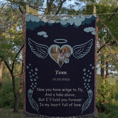 Personalized pet memorial woven blanket with angel wings, halo, photo, name, date, and remembrance poem on a navy background
