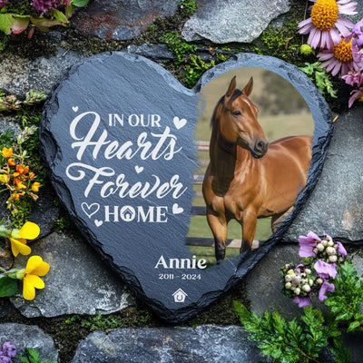 Horse loss tribute plaque with heartfelt quote and name engraving on slate, resting among flowers.