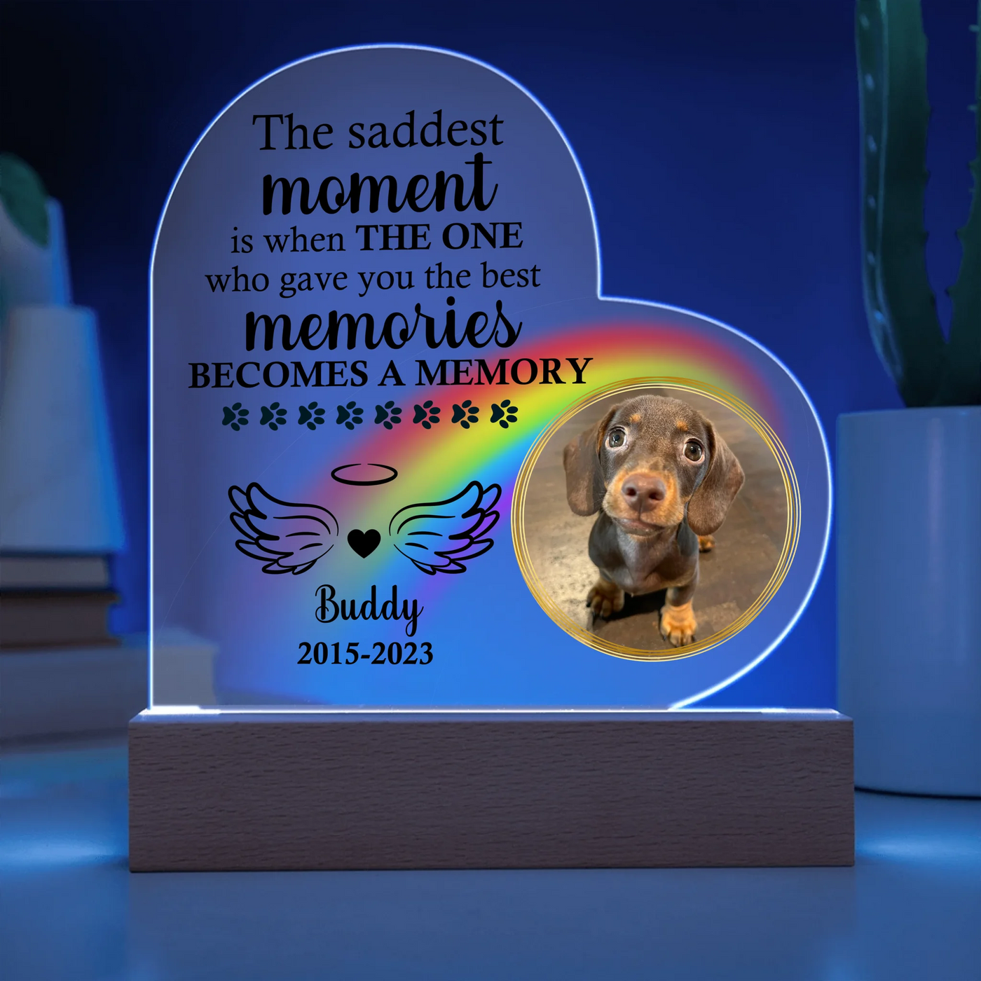 Personalized heart-shaped acrylic memorial plaque featuring a photo of a dog, rainbow design, heartfelt quote, and LED wooden base