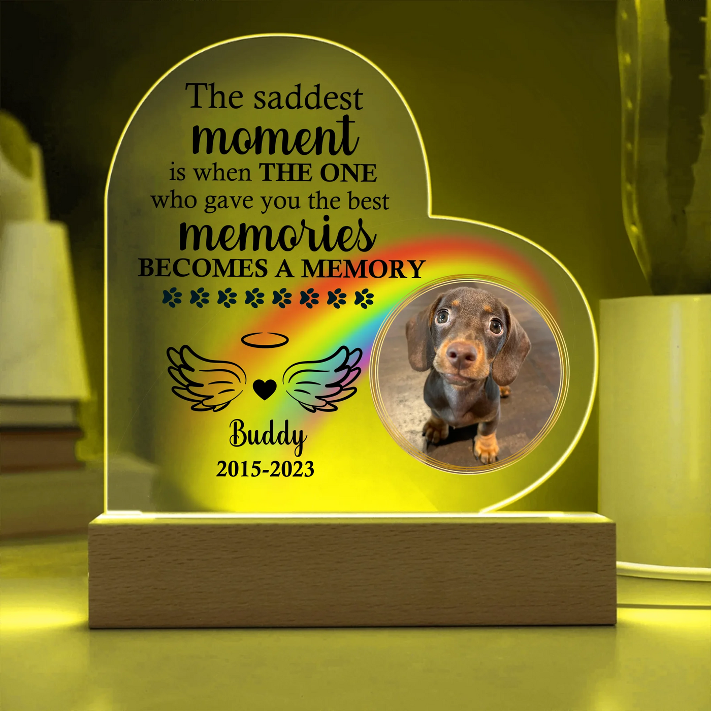 Personalized heart-shaped acrylic memorial plaque featuring a photo of a dog, rainbow design, heartfelt quote, and LED wooden base
