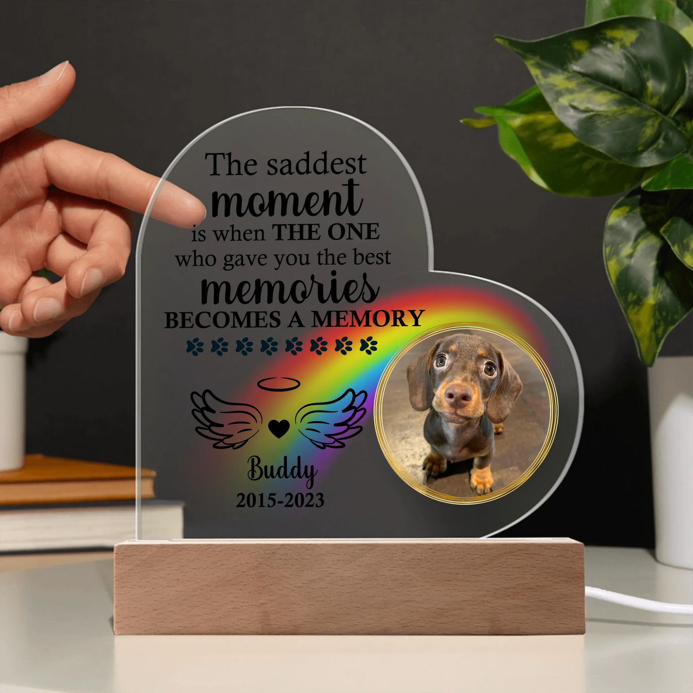 Personalized heart-shaped acrylic memorial plaque featuring a photo of a dog, rainbow design, heartfelt quote, and LED wooden base