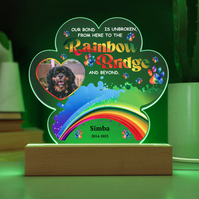 Paw-shaped acrylic LED light featuring a pet photo and the text "Our Bond Is Unbroken from Here to the Rainbow Bridge," perfect as a heartfelt pet memorial