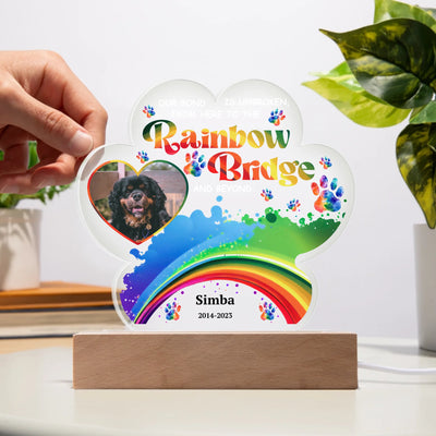 Paw-shaped acrylic LED light featuring a pet photo and the text "Our Bond Is Unbroken from Here to the Rainbow Bridge," perfect as a heartfelt pet memorial