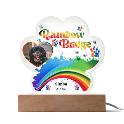 Paw-shaped acrylic LED light featuring a pet photo and the text "Our Bond Is Unbroken from Here to the Rainbow Bridge," perfect as a heartfelt pet memorial
