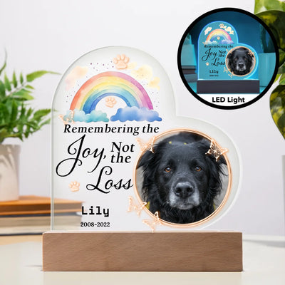 Personalized heart-shaped LED light featuring a photo of a pet, rainbow design, and the words "Remembering the Joy, Not the Loss," perfect for commemorating cherished memories