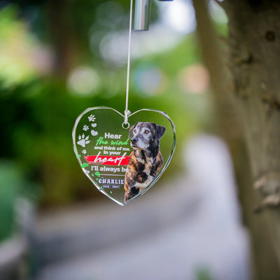 Heart-shaped personalized photo wind chime displayed outdoors, symbolizing remembrance and peace