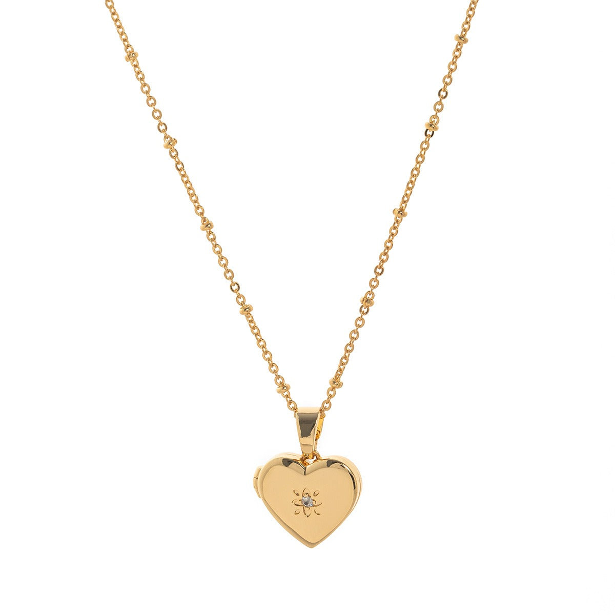 Gold heart-shaped pendant necklace on a white background