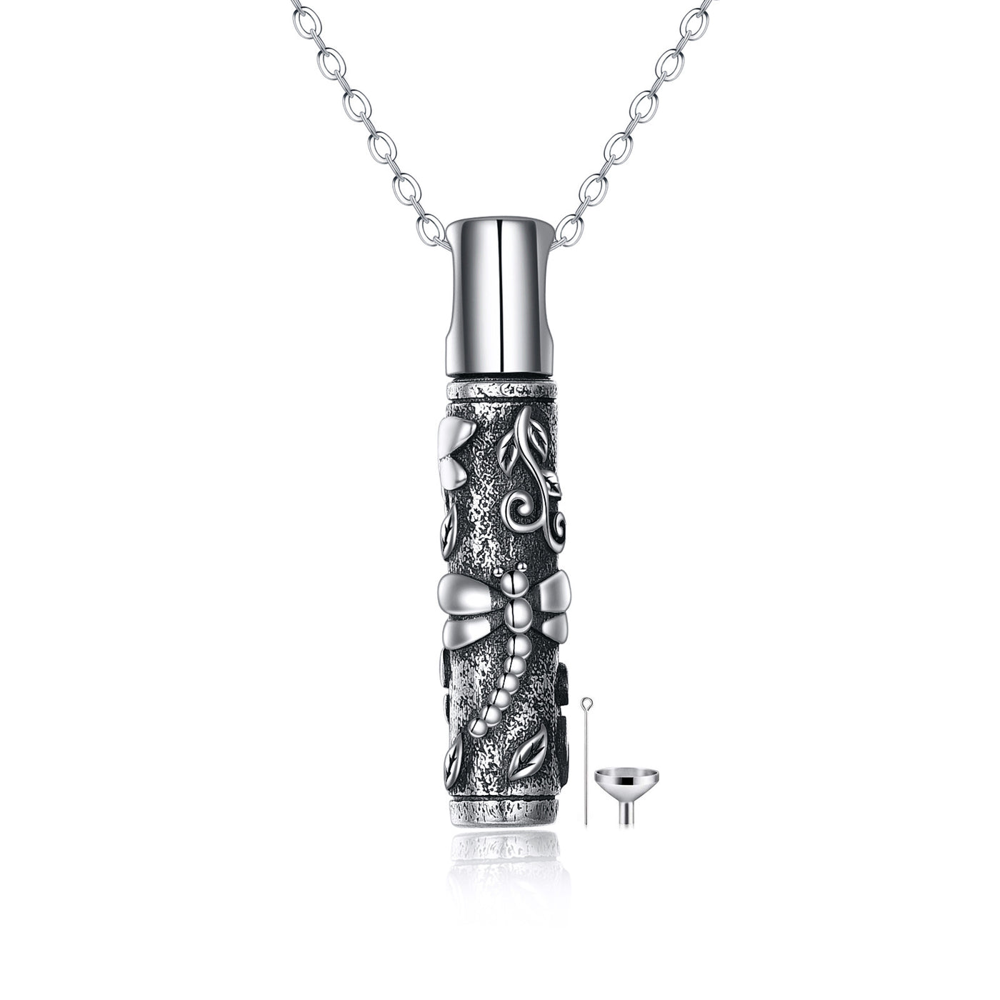 Silver cremation urn necklace with intricate designs on a white background