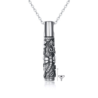 Silver cremation urn necklace with intricate designs on a white background