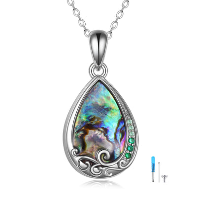 Teardrop-shaped pendant with colorful stone and silver frame on a white background