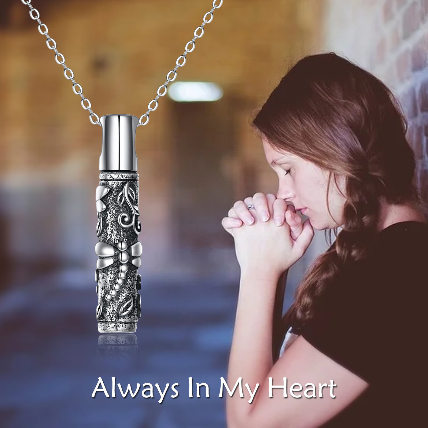 Decorative pendant necklace with a blurred background of a woman praying.