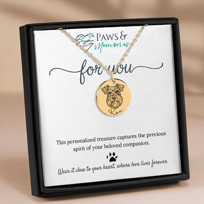 Gold necklace with a dog pendant on a 'Paws & Memories' card.