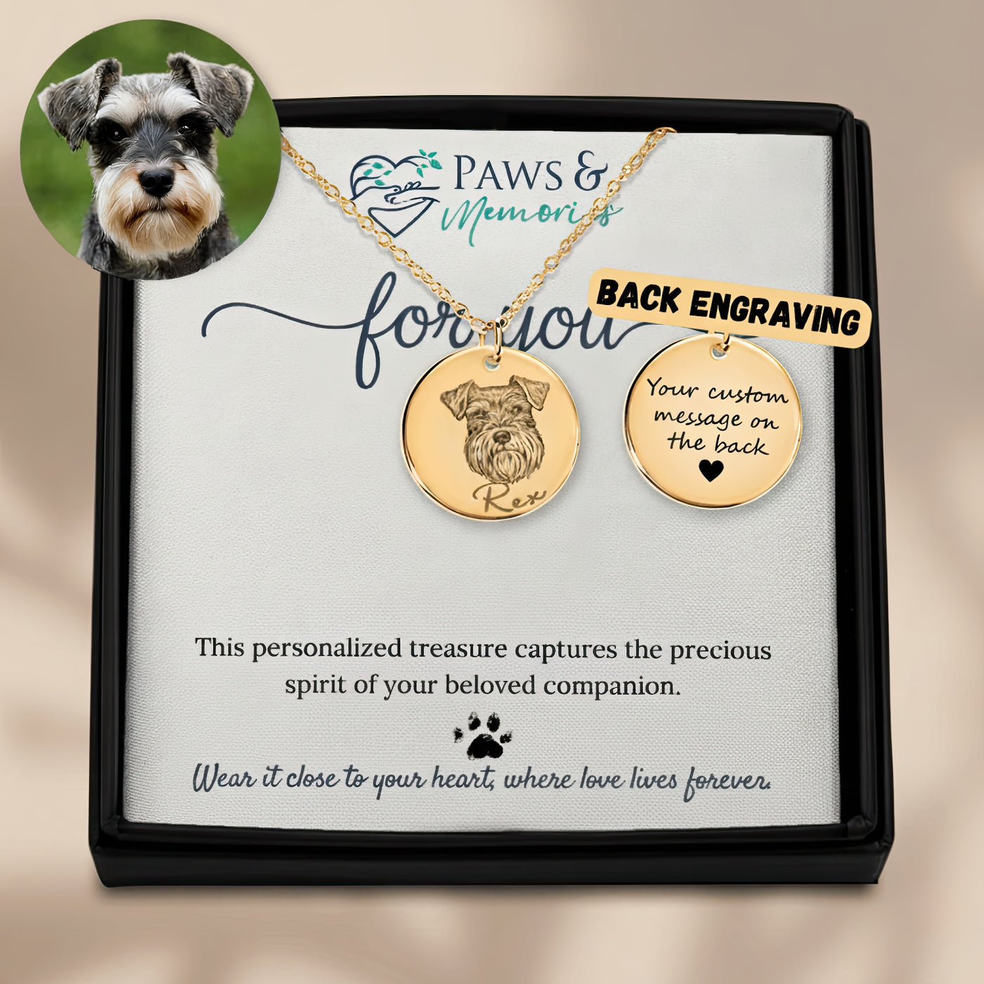 Gold necklace with engraved dog design on a Paws & Memories card.