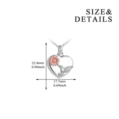 Heart-shaped pendant with a hummingbird and flower design, shown with size measurements on a white background.